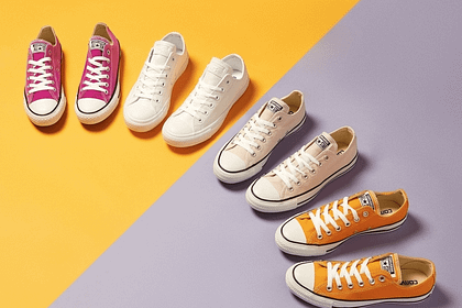 Womens Converse shoes in a yellow-purple split background